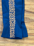 PANTALONES DE CHARRO CON GRECA. AUTHENTIC CHARRO PANTS THAT ARE BLUE COLOR WITH TAN SUEDE LEATHER STITCHED STENCEIL ART WORK