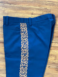 PANTALONES DE CHARRO CON GRECA. AUTHENTIC CHARRO PANTS THAT ARE BLUE COLOR WITH TAN SUEDE LEATHER STITCHED STENCEIL ART WORK