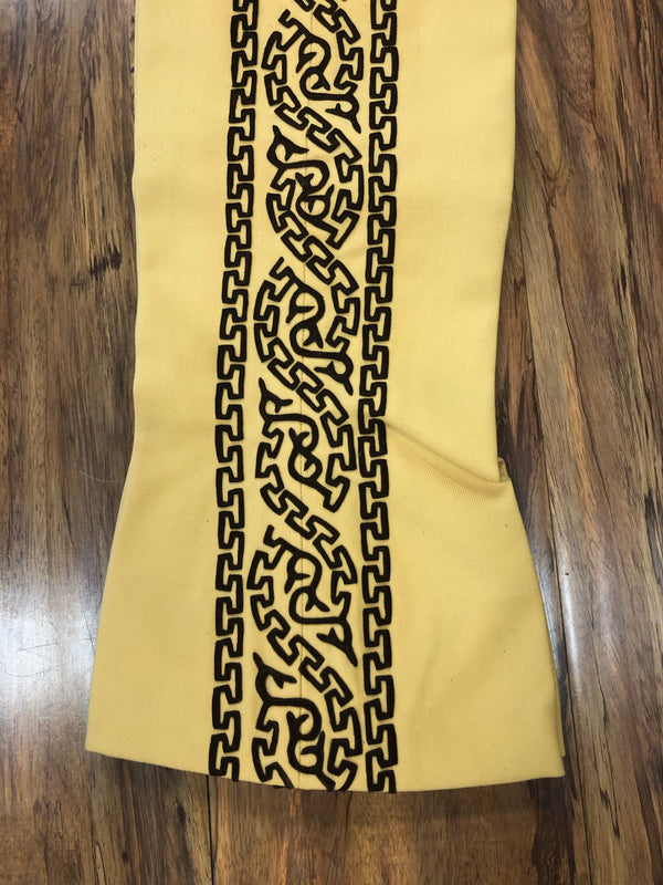 PANTALONES DE CHARRO. AUTHENTIC CHARRO PANTS THAT ARE YELLOW  WITH BROWN SUEDE LEATHER STITCHED STENCIL ART WORK , HerraduraDeOro - HerraduraDeOro