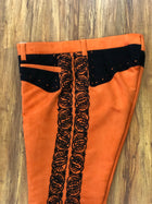PANTALON DE CHARRO. AUTHENTIC CHARRO PANTS THAT ARE ORANGE WITH MOCA BROWN SUEDE LEATHER STITCHED STENCIL ART WORK
