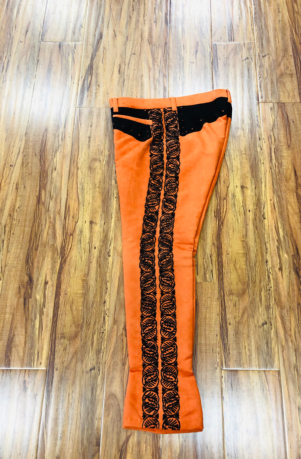 PANTALON DE CHARRO. AUTHENTIC CHARRO PANTS THAT ARE ORANGE WITH MOCA BROWN SUEDE LEATHER STITCHED STENCIL ART WORK