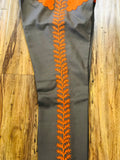 PANTALONES DE CHARRO. AUTHENTIC CHARRO PANTS THAT ARE BROWN WITH CARROT SUEDE LEATHER STITCHED STENCIL ART WORK