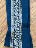 PANTALONES DE CHARRO CON GRECA. AUTHENTIC CHARRO PANTS THAT ARE WINE COLOR WITH TAN SUEDE LEATHER STITCHED STENCEIL ART WORK