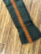 PANTALONES DE CHARRO CON GRECA. AUTHENTIC CHARRO PANTS THAT ARE GREEN COLOR WITH CARROT SUEDE LEATHER STITCHED STENCEIL ART WORK