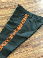 PANTALONES DE CHARRO CON GRECA. AUTHENTIC CHARRO PANTS THAT ARE GREEN COLOR WITH CARROT SUEDE LEATHER STITCHED STENCEIL ART WORK