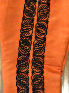PANTALON DE CHARRO. AUTHENTIC CHARRO PANTS THAT ARE ORANGE WITH MOCA BROWN SUEDE LEATHER STITCHED STENCIL ART WORK